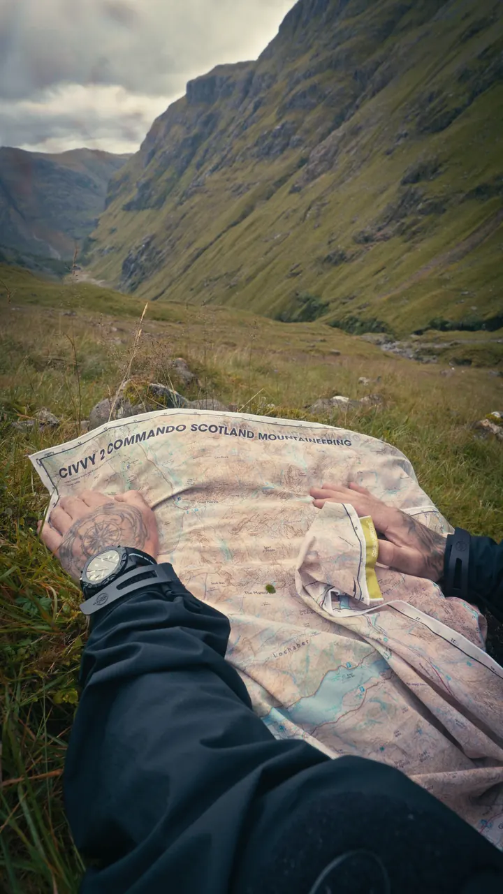 Map navigation exercise above a Scottish valley